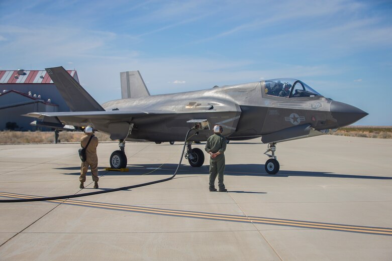 U.S. Marines with Marine Aircraft Group (MAG) 13 conduct refueling operations during a Strike Coordination and Reconnaissance (SCAR) mission aboard a simulated naval vessel at KNOZ range, Yuma, AZ., March 4, 2021. The large-force exercise was implemented in order to project the capabilities of "island hopping" and consisted of multiple MAG-13 assets, including ground support from Marine Wing Support Squadron (MWSS) 371 and aircraft from Marine Fighter Attack Squadron (VMFA) 122. (U.S. Marine Corps photo by Lance Cpl John Hall)