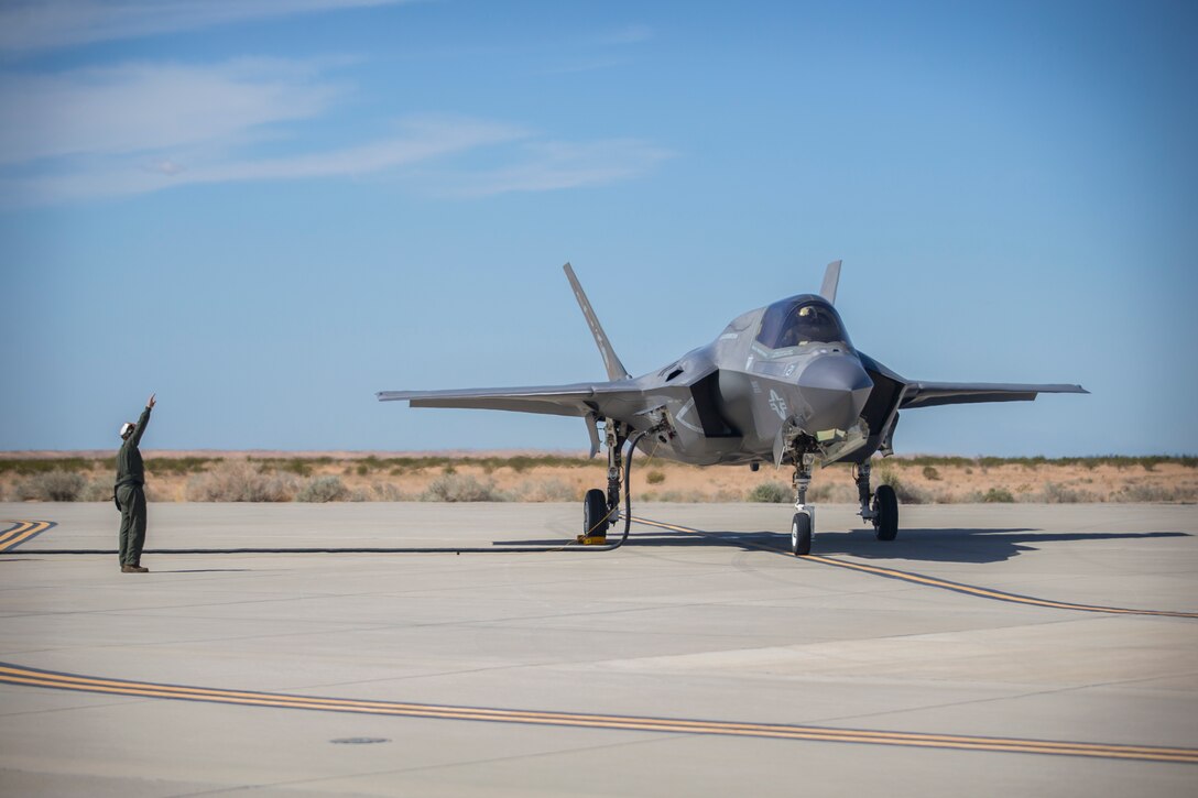 U.S. Marines with Marine Aircraft Group (MAG) 13 conduct refueling operations during a Strike Coordination and Reconnaissance (SCAR) mission aboard a simulated naval vessel at KNOZ range, Yuma, AZ., March 4, 2021. The large-force exercise was implemented in order to project the capabilities of "island hopping" and consisted of multiple MAG-13 assets, including ground support from Marine Wing Support Squadron (MWSS) 371 and aircraft from Marine Fighter Attack Squadron (VMFA) 122. (U.S. Marine Corps photo by Lance Cpl John Hall)