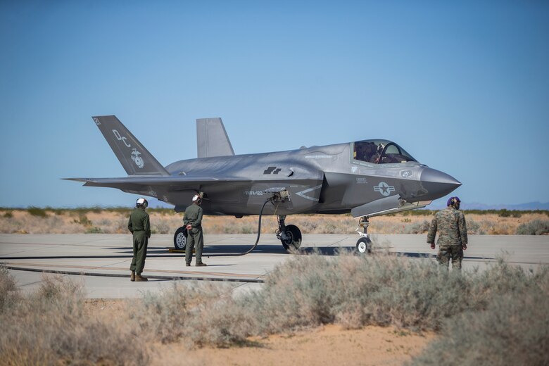 U.S. Marines with Marine Aircraft Group (MAG) 13 conduct refueling operations during a Strike Coordination and Reconnaissance (SCAR) mission aboard a simulated naval vessel at KNOZ range, Yuma, AZ., March 4, 2021. The large-force exercise was implemented in order to project the capabilities of "island hopping" and consisted of multiple MAG-13 assets, including ground support from Marine Wing Support Squadron (MWSS) 371 and aircraft from Marine Fighter Attack Squadron (VMFA) 122. (U.S. Marine Corps photo by Lance Cpl John Hall)
