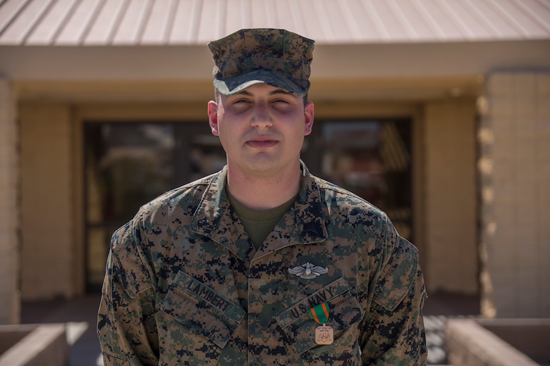 U.S. Navy Hospital Corpsman Third Class Randall Lambert stands wearing a Navy and Marine Achievement Medal at Cannon Air Defense Complex in Yuma Ariz. Mar 5 2021. The Navy and Marine Achievement Medal is awarded for superior performance of a service member's duties. ( U.S. Marine Corps photo by Lance Cpl. Carlos Kealy)