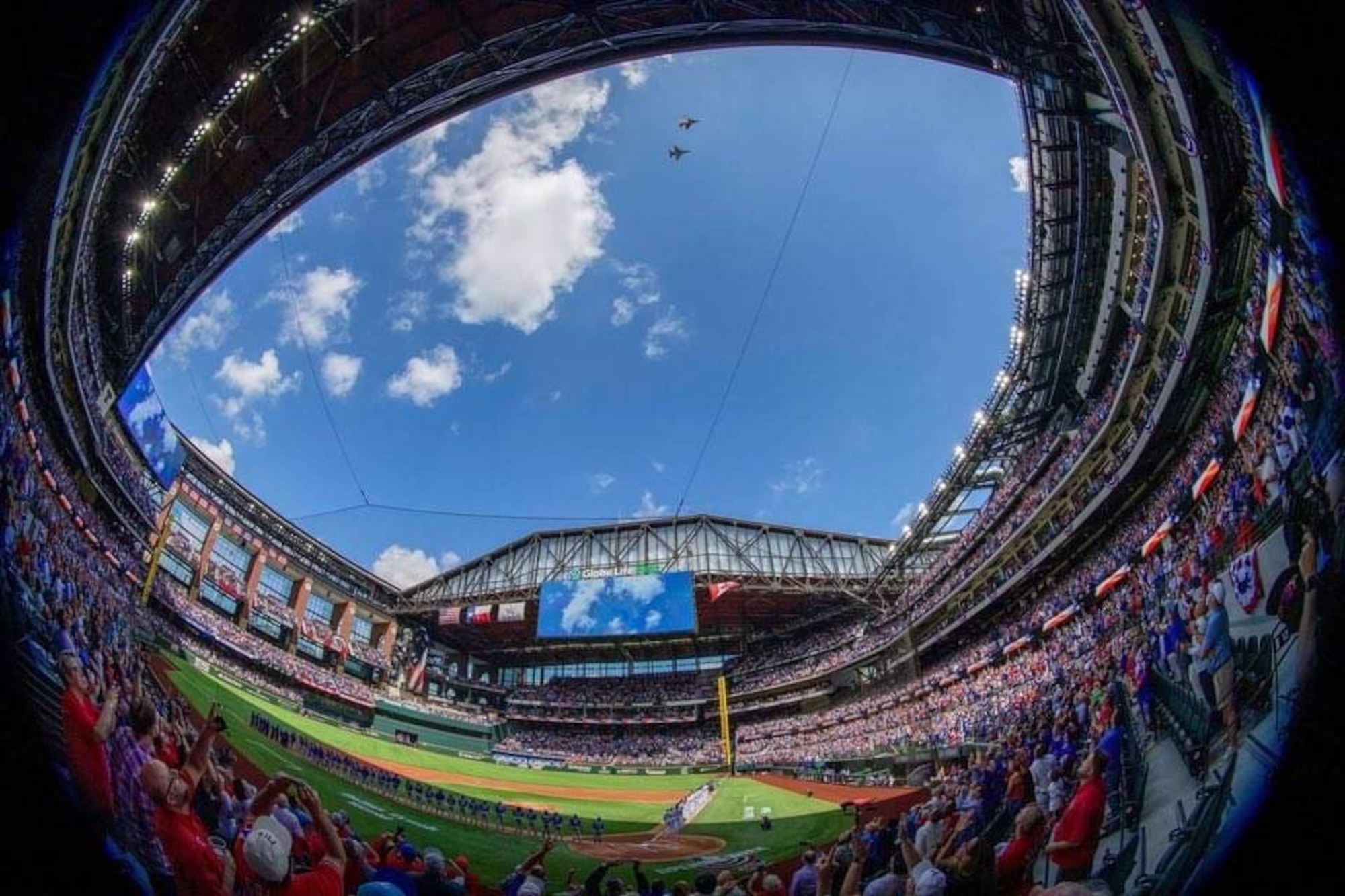 F-16C Fighting Falcon pilots assigned to the 457th Fighter Squadron, 301st Fighter Wing, U.S. Naval Air Station Joint Reserve Base Fort Worth, Texas performed a flyover during the opening ceremony for Major League Baseball’s Texas Rangers team on Opening Day at Globe Life Field, April 5, 2021. The stadium opened for the first time to the public for a Texas Rangers game since its construction in 2020.