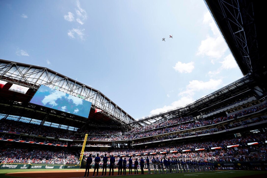 F-16C Fighting Falcon pilots assigned to the 457th Fighter Squadron, 301st Fighter Wing, U.S. Naval Air Station Joint Reserve Base Fort Worth, Texas performed a flyover during the opening ceremony for Major League Baseball’s Texas Rangers team on Opening Day at Globe Life Field, April 5, 2021. The stadium opened for the first time to the public for a Texas Rangers game since its construction in 2020.