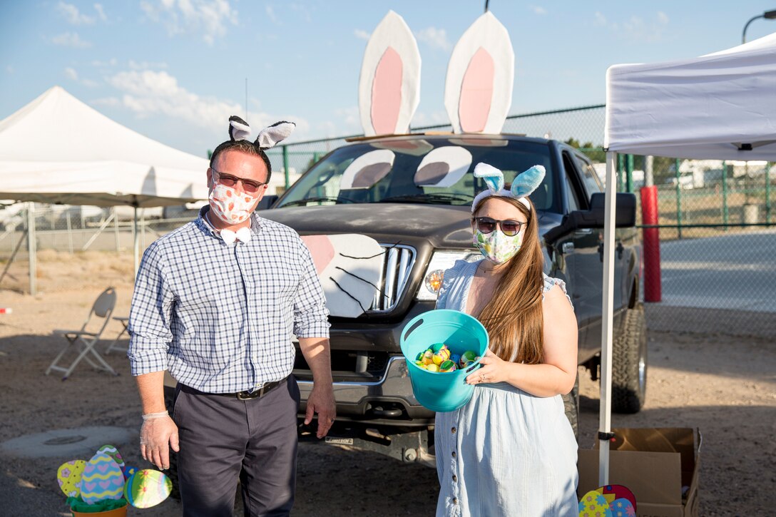 Volunteers hand out eggs during the Easter Eggstravaganza on Marine Corps Air Station Yuma, April 1, 2021. The drive-through event allowed military children and their families a chance to participate in the excitement of gathering eggs, toys and candy. (U.S. Marine Corps photo by Sgt. Nicole Rogge)