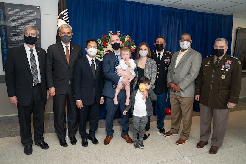 Group photo of U.S., Vietnamese officials and family members in the Pentagon.