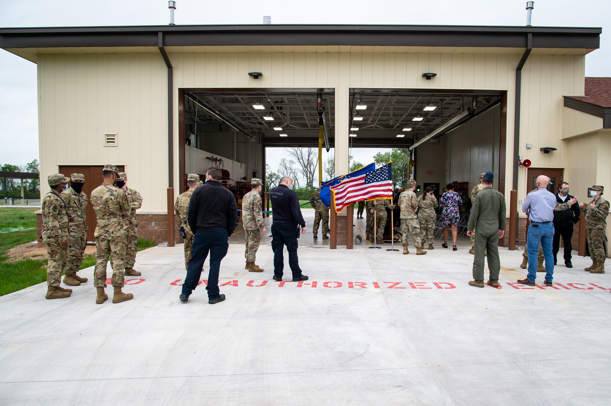 Base personnel gather outside Fire Station Two for a ribbon cutting ceremony at Barksdale Air Force Base, Louisiana, April 7, 2021.