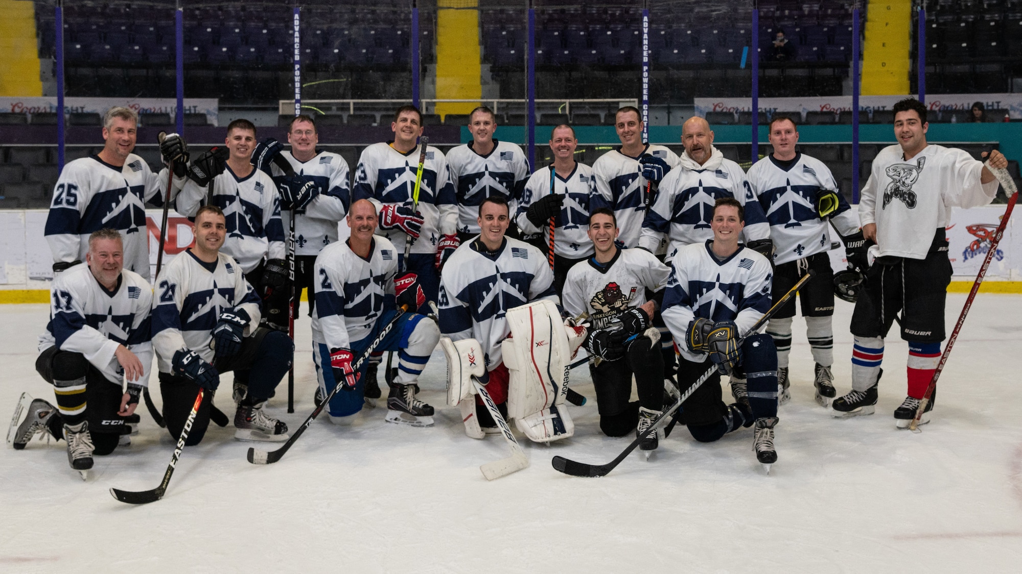 The Barksdale Bombers hockey team from Barksdale Air Force Base, Louisiana, pose for a group photo in the Hirsch Memorial Coliseum at Shreveport, Louisiana, March 31, 2021.