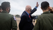 Honorable John P. Roth, acting Secretary of the Air Force, waves at a passing B-52H Stratofortress during a tour at Barksdale Air Force Base, Louisiana, April 6, 2021.