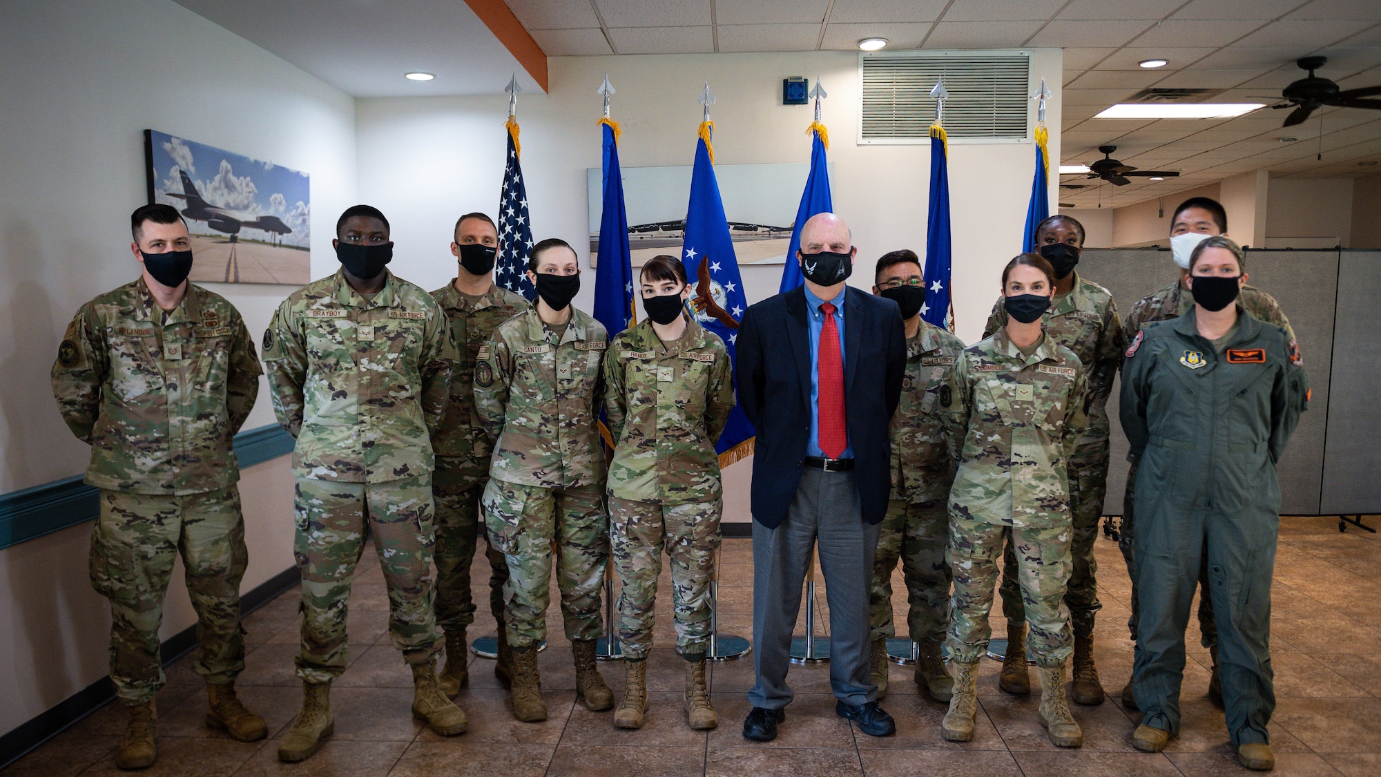 Honorable John P. Roth, acting Secretary of the Air Force, poses for a photo with Barksdale Airmen during a tour at Barksdale Air Force Base, Louisiana, April 6, 2021.