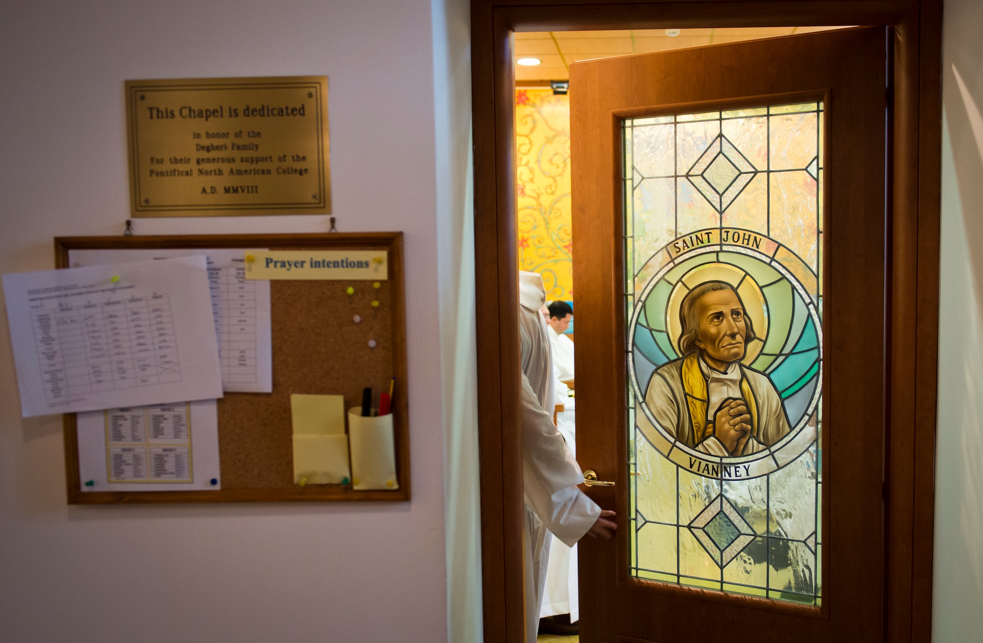 Retired Chaplain (Lt. Col.) Robert Bruno closes the door to the chapel as he joins Catholic Mass on the Northern American College campus in Rome. (U.S. Air Force photo/Staff Sgt. Andrew Lee)