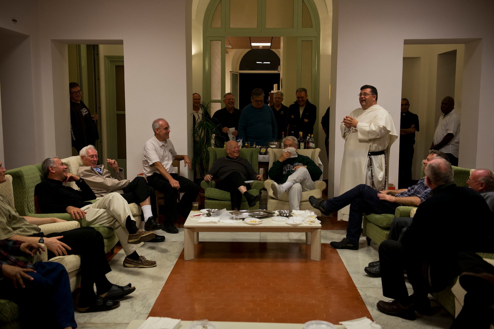 Members of the Pontifical Northern American College sabbatical program share a laugh together. (U.S. Air Force photo/Staff Sgt. Andrew Lee)