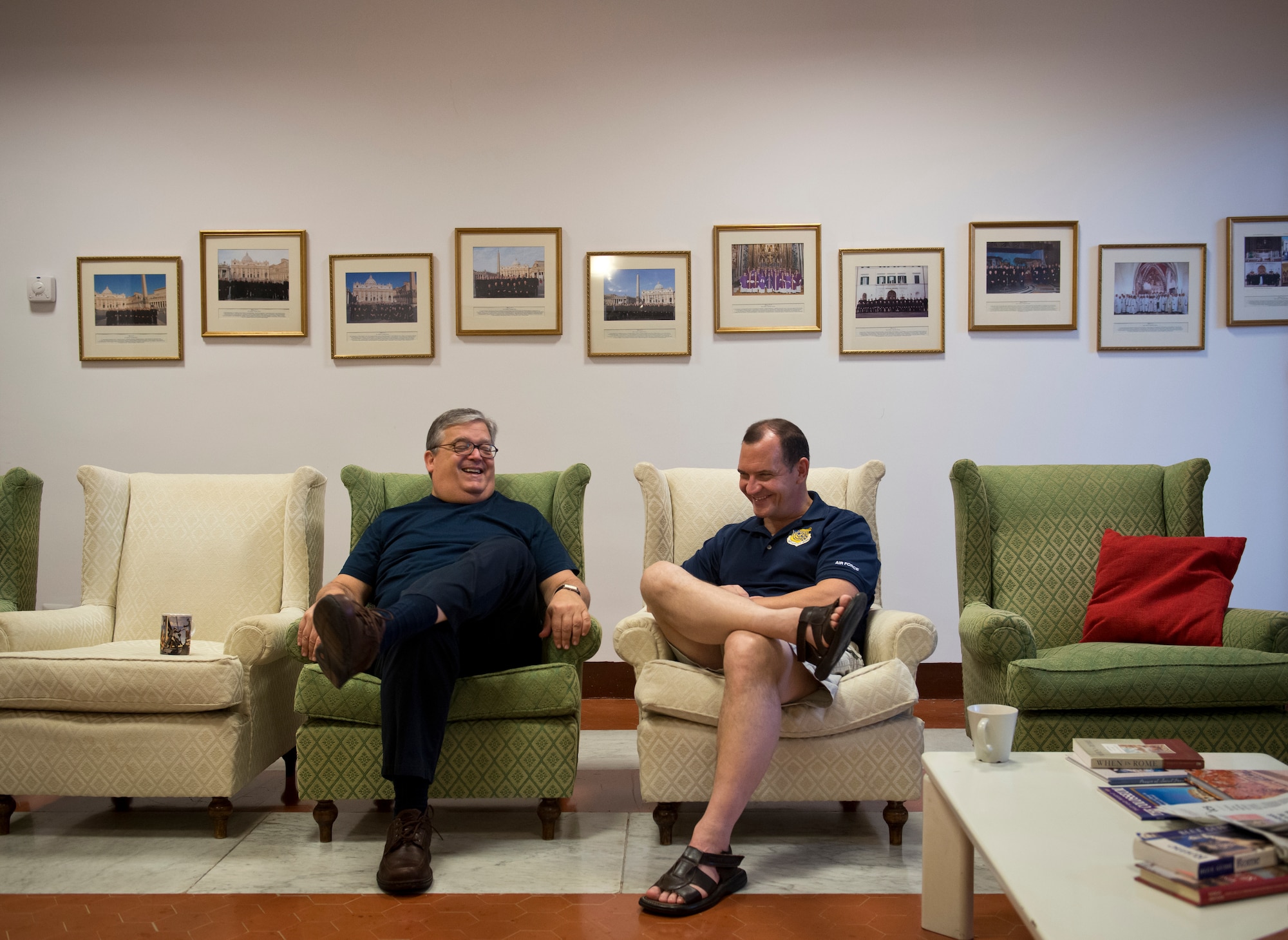 Retired Chaplain (Lt. Col.) Stephen Voyt (right) and Monsignor Anthony Mancini share a laugh together in the dayroom of the sabbatical's participants dormitory. (U.S. Air Force photo/Staff Sgt. Andrew Lee)