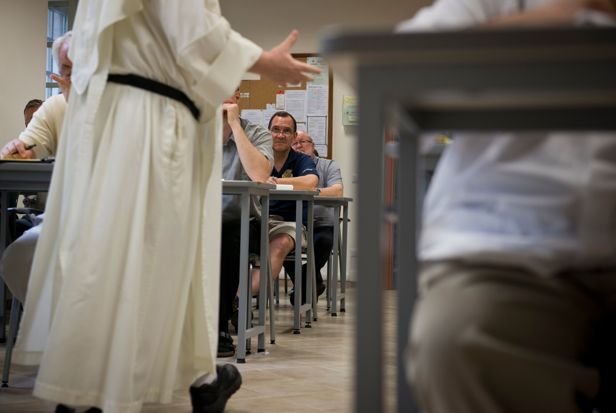 Retired Chaplain (Lt. Col.) Stephen Voyt listens to to the instructor in his class at the Pontifical North American College Institute of Continuing Theological Education. While they are continuing their education, the program is designed to give Catholic priests a sabbatical after years of providing service to others. (U.S. Air Force photo/Staff Sgt. Andrew Lee)