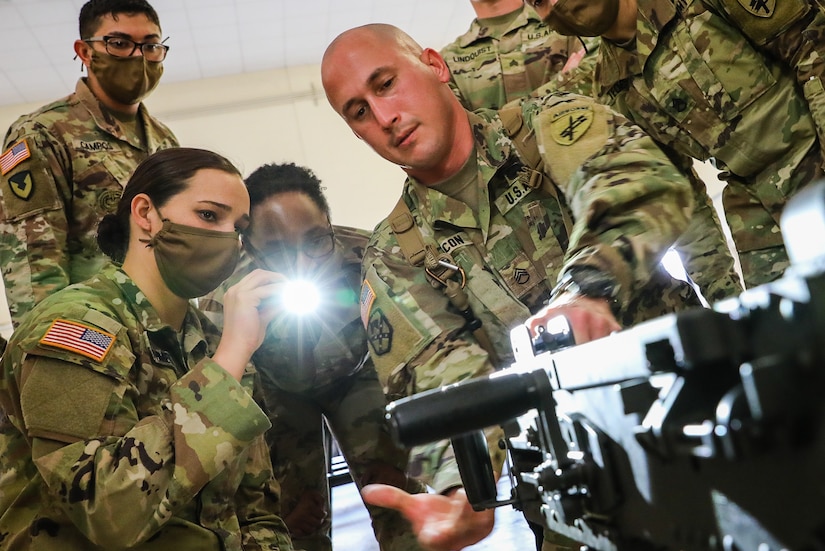 U.S. Army Reserve Staff Sgt. Jonathan Chacon, right, a civil affairs specialist with the 426th Civil Affairs Battalion (Airborne), demonstrates to his fellow competitors how to maintain an M2 .50-caliber machine gun during the first day of the 2021 the U.S. Army Civil Affairs and Psychological Operations Command (Airborne) Best Warrior Competition at Fort Jackson, S.C. The USACAPOC(A) BWC is an annual competition that brings in the best Soldiers across USACAPOC(A) to earn the title of “Best Warrior.” BWC tests the Soldiers’ individual ability to adapt and overcome challenging scenarios and battle-focused events, testing their technical and tactical skills under stress and extreme fatigue.
