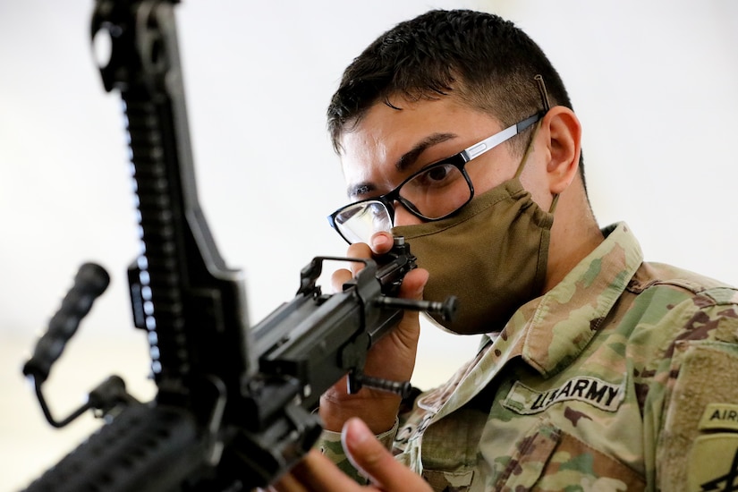 U.S. Army Reserve Staff Sgt. Marco Campos, a civil affairs specialist with the 410th Civil Affairs Battalion, assembles an M249 squad automatic weapon during the first day of the 2021 U.S. Army Civil Affairs and Psychological Operations Command (Airborne) Best Warrior Competition at Fort Jackson, S.C. April 7, 2021. The USACAPOC(A) BWC is an annual competition that brings in the best Soldiers across USACAPOC(A) to earn the title of “Best Warrior.” BWC tests the Soldiers’ individual ability to adapt and overcome challenging scenarios and battle-focused events, testing their technical and tactical skills under stress and extreme fatigue.