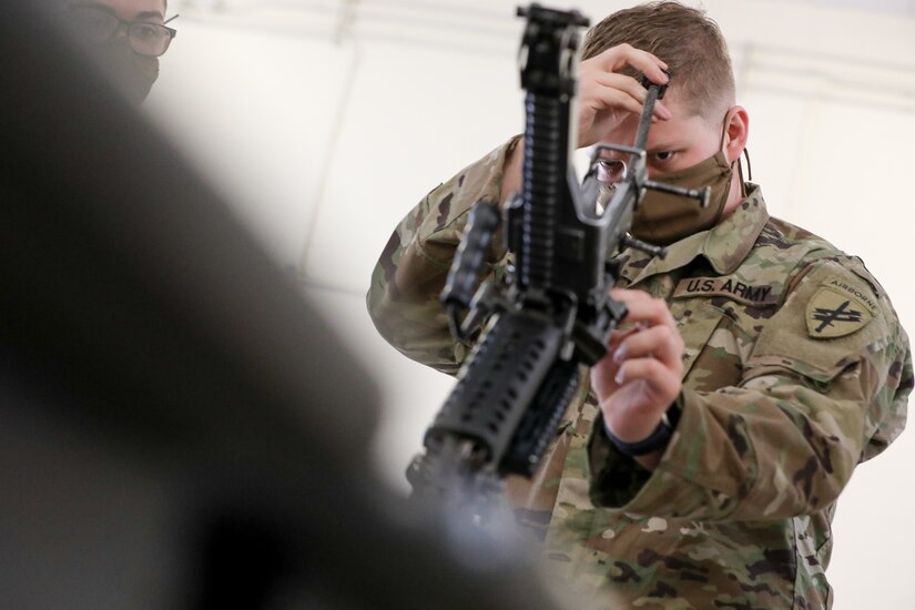 U.S. Army Reserve Spc. Timothy Lowitzer, a Philadelphia, Pennsylvania native, and civil affairs specialist with the 1001st Civil Affairs and Psychological Operations Company, assembles an M249 squad automatic weapon during the first day of the 2021 U.S. Army Civil Affairs and Psychological Operations Command (Airborne) Best Warrior Competition at Fort Jackson, S.C., April 7, 2021. The USACAPOC(A) BWC is an annual competition that brings in the best Soldiers across USACAPOC(A) to earn the title of “Best Warrior.” BWC tests the Soldiers’ individual ability to adapt and overcome challenging scenarios and battle-focused events, testing their technical and tactical skills under stress and extreme fatigue.
