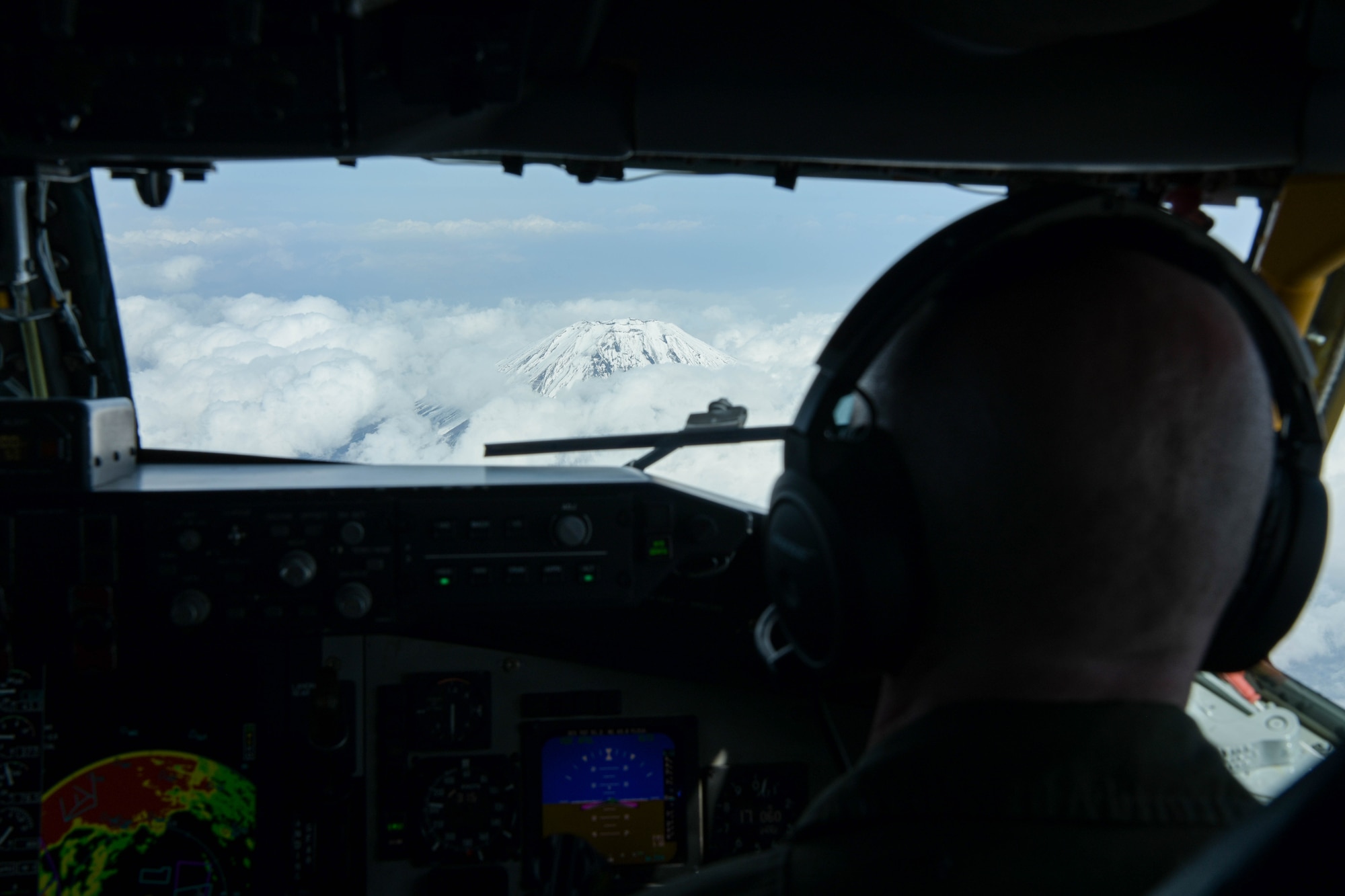 U.S. Air Force Capt. Trevor Gardner, 909th Air Refueling Squadron KC-135 Stratotanker pilot, looks at Mt. Fuji, Japan, April 1, 2021. The 909th ARS’s mission is to refuel aircraft in the air, enabling Pacific Air Forces to maintain a free and open Indo-Pacific. (U.S. Air Force photo by Senior Airman Rebeckah Medeiros)
