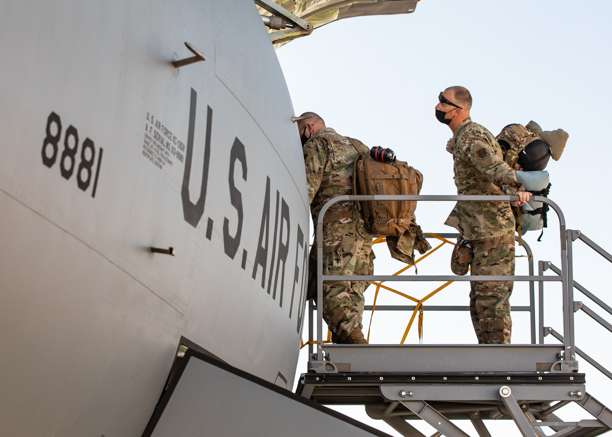 Airmen loading into airplane