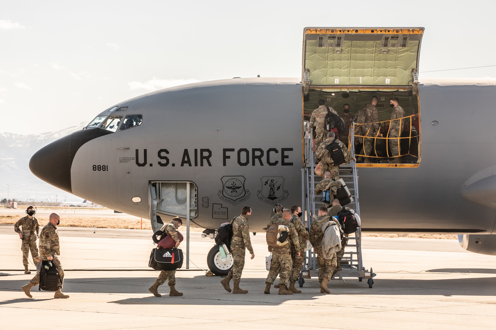 Airmen loading into airplane.