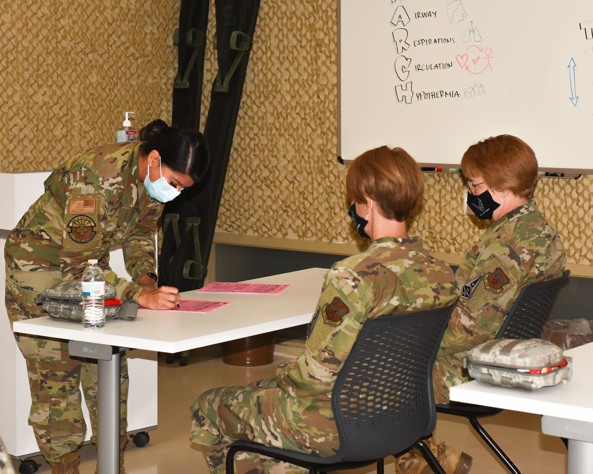 Airman signing documents