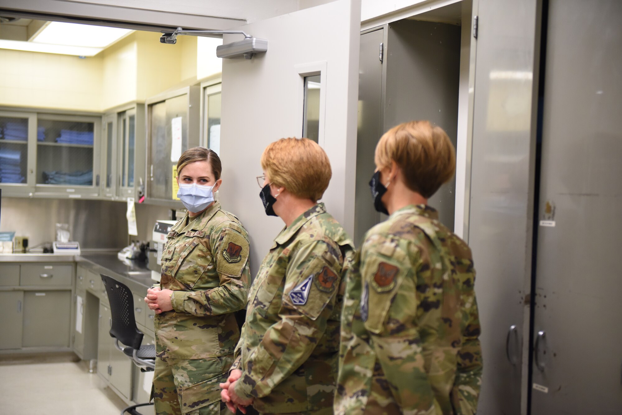 Airman talking to a general and chief