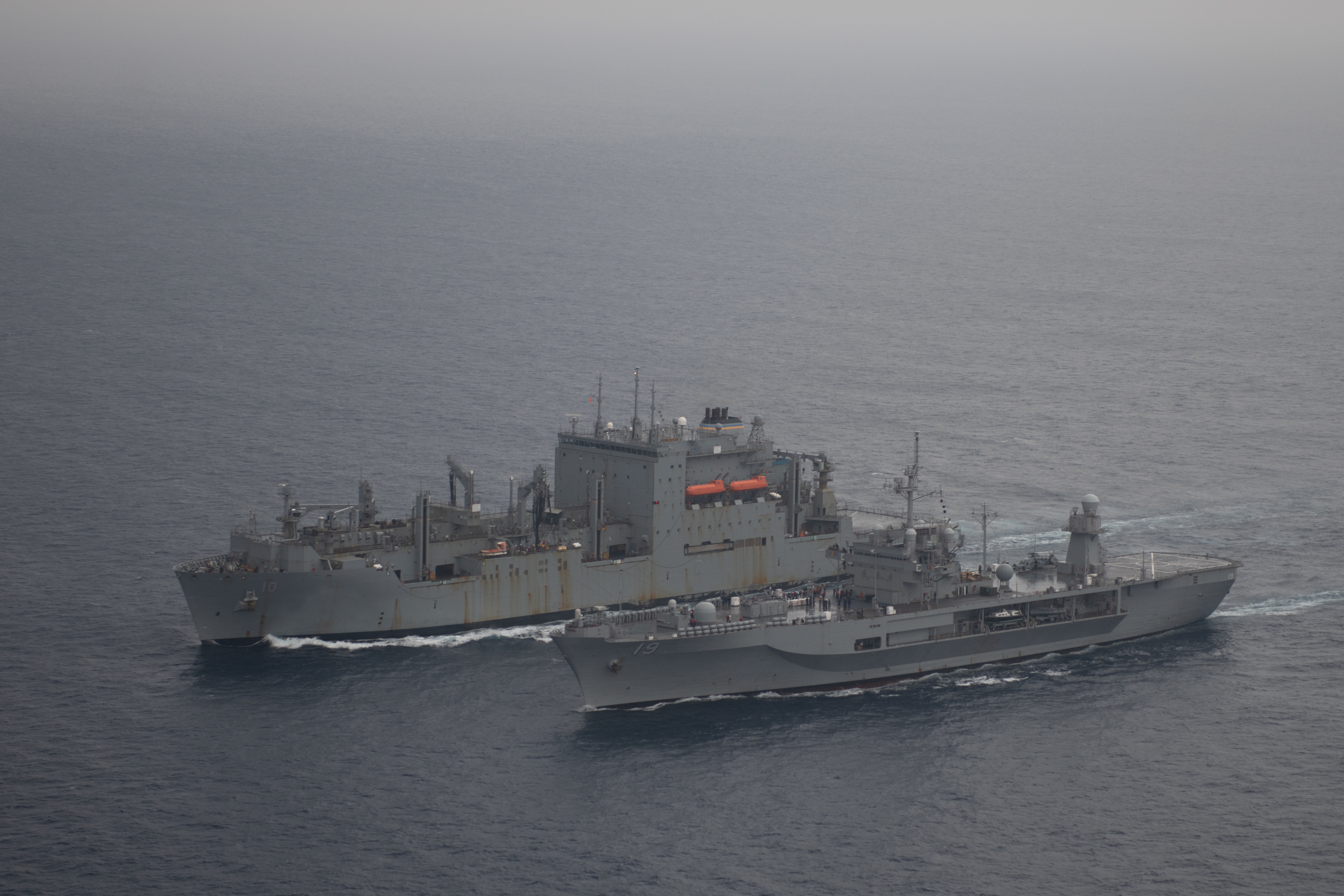 U.S. 7th Fleet flagship USS Blue Ridge (LCC 19), right, completes an underway replenishment with the Military Sealift Command dry cargo and ammunition ship USNS Charles Drew (T-AKE 10) in the East China Sea.