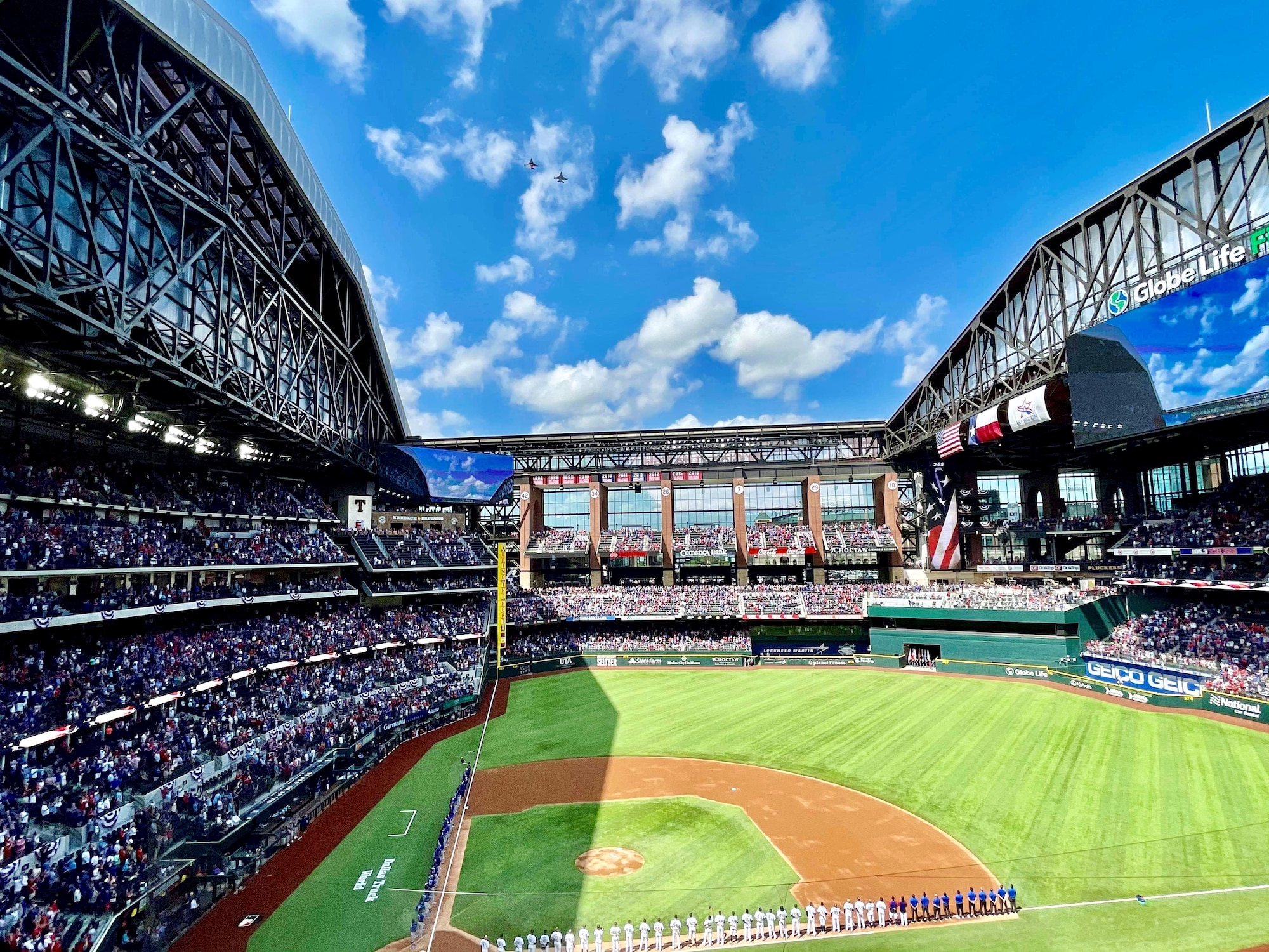 F-16C Fighting Falcon pilots assigned to the 457th Fighter Squadron, 301st Fighter Wing, U.S. Naval Air Station Joint Reserve Base Fort Worth, Texas performed a flyover during the opening ceremony for Major League Baseball’s Texas Rangers team on Opening Day at Globe Life Field, April 5, 2021. The stadium opened for the first time to the public for a Texas Rangers game since its construction in 2020.