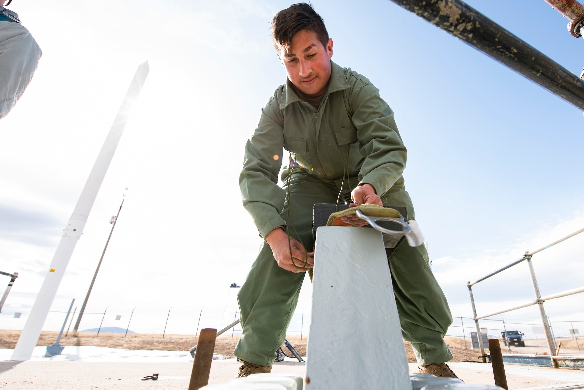Airman 1st Class Emilio Gilliam, 341st Missile Maintenance Squadron missile maintenance trainee, performs topside maintenance of a launch facility March 27, 2021, near Malmstrom Air Force Base, Mont.