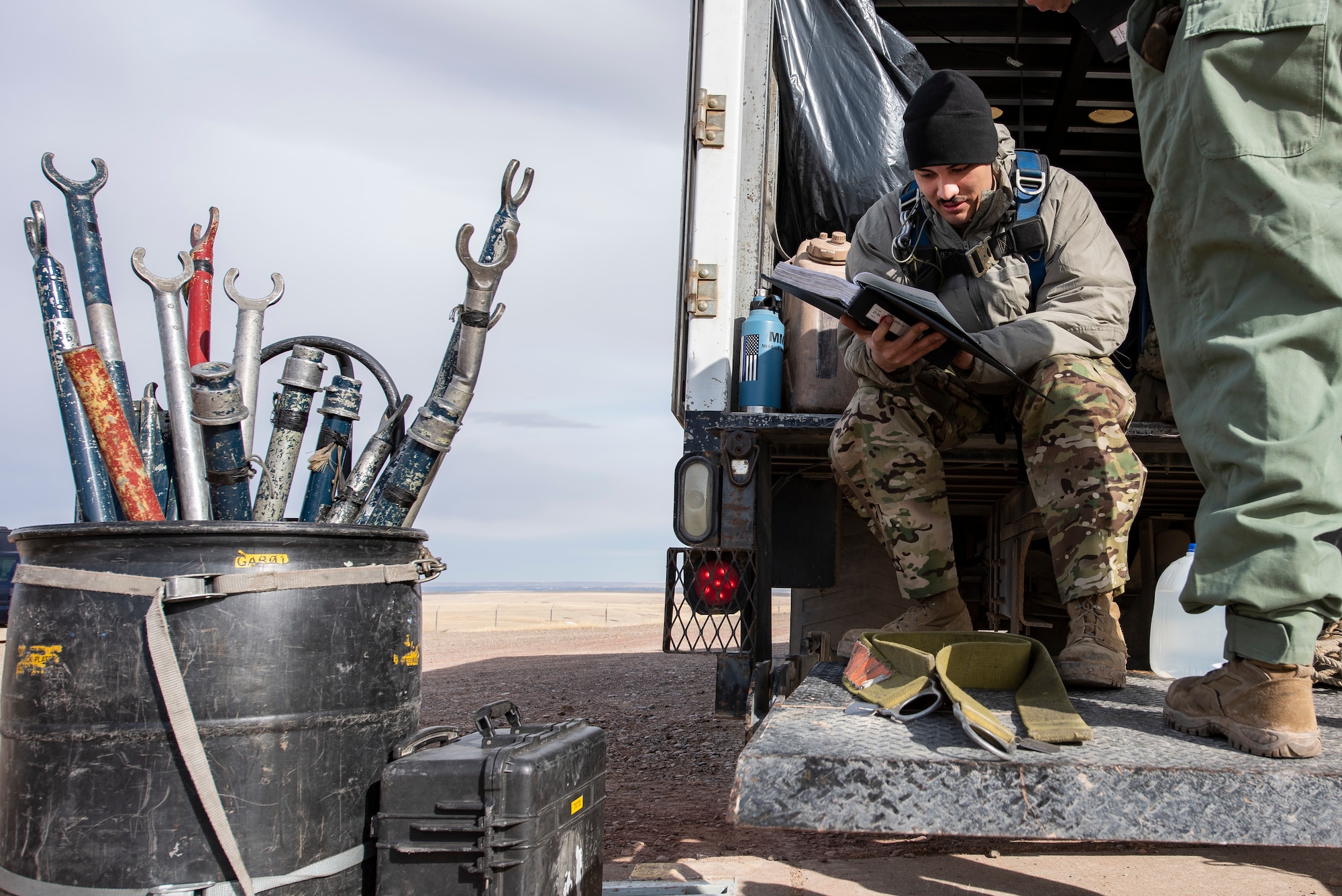 Senior Airman Ruel Gomez, 341st Missile Maintenance Squadron missile maintenance trainee, studies a technical order March 27, 2021, at a launch facility near Malmstrom Air Force Base, Mont.