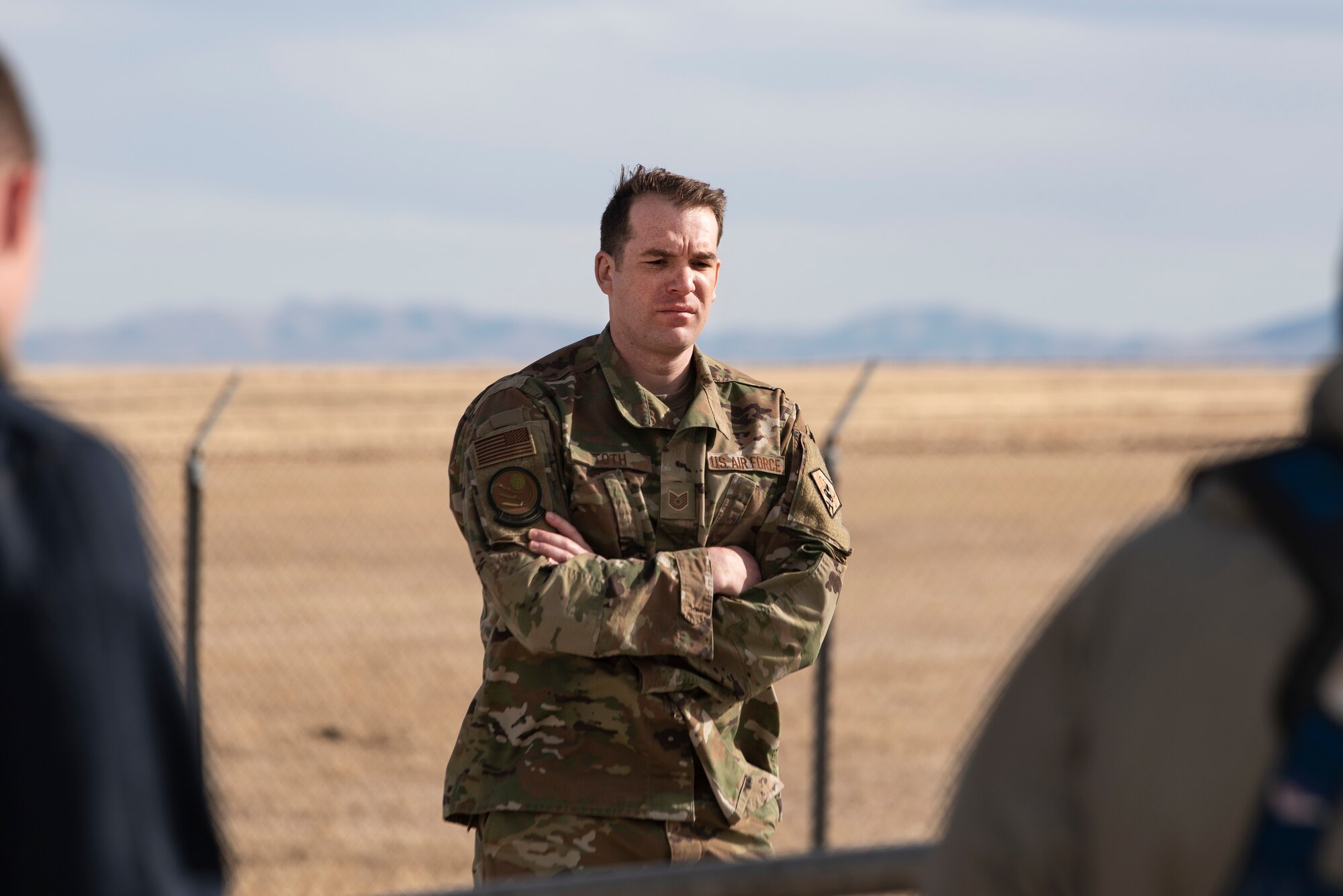 Tech. Sgt. Louis Toth, 373rd Training Squadron Det. 22 electromechanical team instructor, looks on as maintainers conduct training March 19, 2021, at a launch facility near Malmstrom Air Force Base, Mont.
