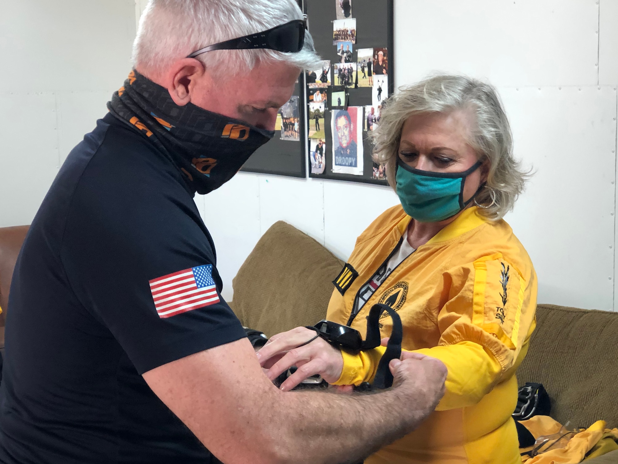 Ellen Comfort and Army Lt. Col. Ken Ates, Special Operations Command Para-Commando, rehearse skydiving procedures March 13, 2021, prior to a jump in Zephyrhills, Florida.