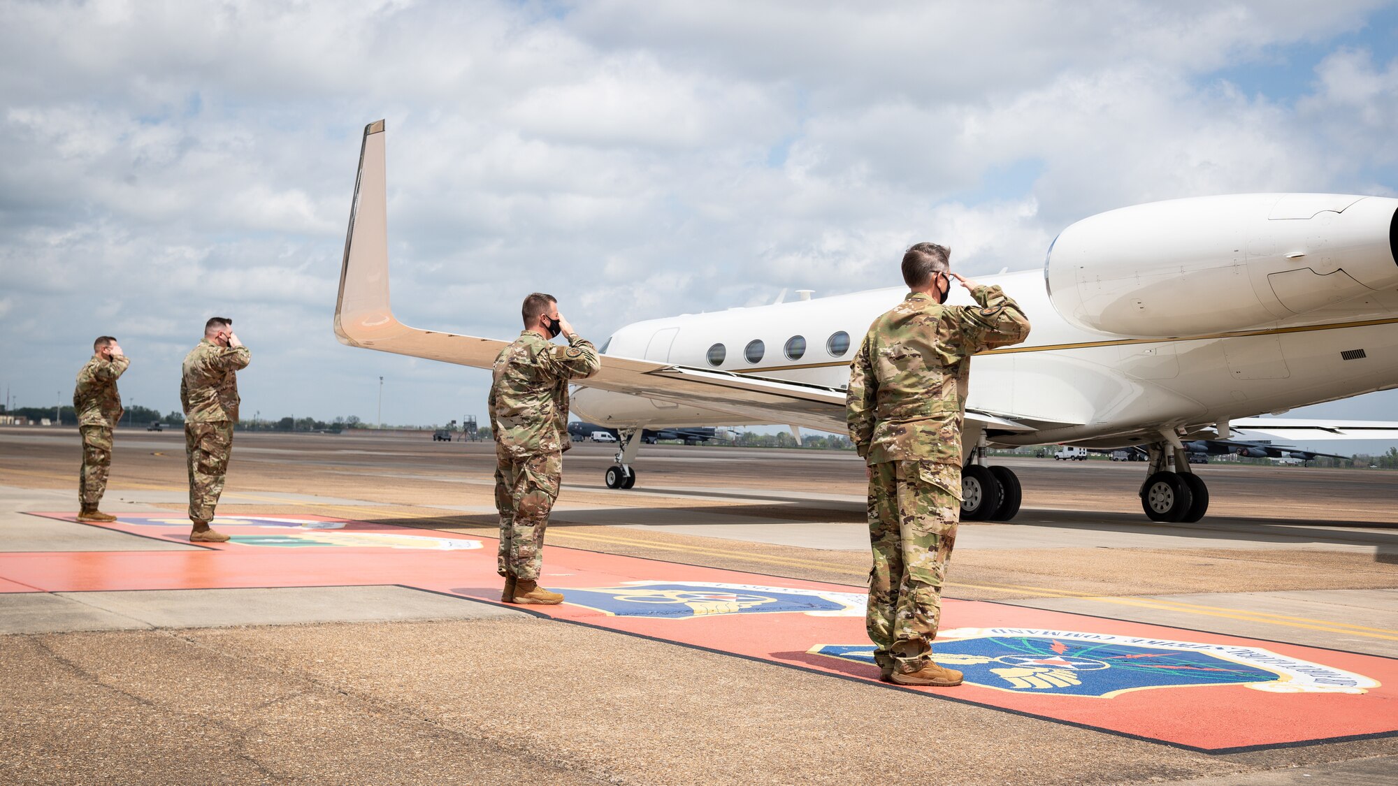 Leaders from the 2nd Bomb Wing and Air Force Global Strike Command salute the departure of Honorable John P. Roth, acting Secretary of the Air Force, at Barksdale Air Force Base, Louisiana, April 6, 2021.