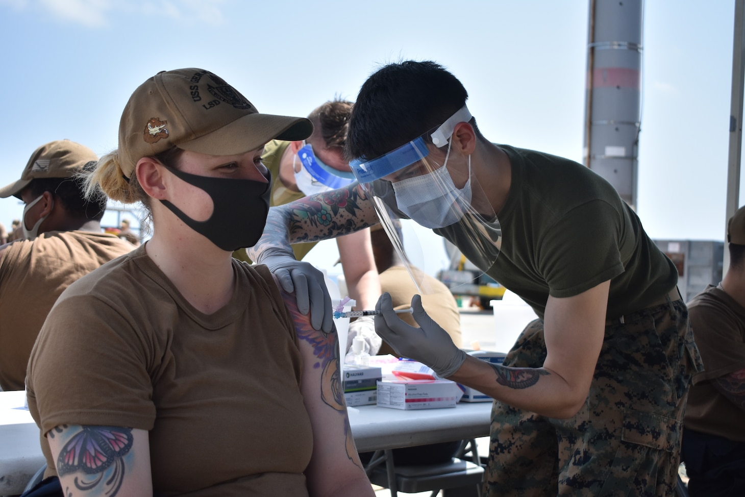 OKINAWA, Japan (Mar. 16, 2021) Boatswain’s Mate 2nd Class Anjellica Beyner, from Kissimmee, Fla., assigned to the amphibious dock landing ship USS Germantown (LSD 42), receives the second dose of the Moderna COVID-19 vaccine. Germantown, part of Amphibious Squadron 11, along with the 31st Marine Expeditionary Unit, is operating in the U.S. 7th Fleet area of responsibility to enhance interoperability with allies and partners and serve as a ready response force to defend peace and stability in the Indo-Pacific region. (U.S. Navy photo by Lt. j.g. Yeltsin E. Rodriguez)