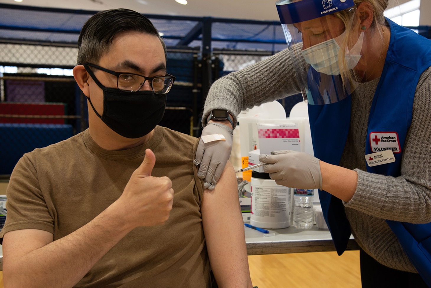 YOKOSUKA, Japan (March 18, 2021) — Cmdr. Terry McNamara, chief staff officer for Commander, Fleet Activities Yokosuka (CFAY) receives his one-shot Johnson & Johnson COVID-19 vaccine from Mercedes Fritz, a residency nurse with American Red Cross Yokosuka, during a vaccine distribution at CFAY’s Hawk’s Nest. Service members assigned to CFAY and tenant commands received the one-shot vaccine during the vaccine distribution.  For more than 75 years, CFAY has provided, maintained, and operated base facilities and services in support of the U.S. 7th Fleet's forward-deployed naval forces, tenant commands, and thousands of military and civilian personnel and their families. (U.S. Navy photo by Ryo Isobe)