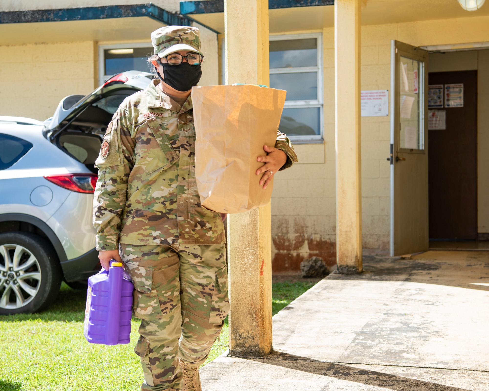 U.S. Air Force Senior Airman Monica Mendez, Air Force Sergeants Association Chapter 1560 member, carries donation items at The Salvation Army Guam Corps headquarters in Barrigada, Guam, April 8, 2021. Members from Andersen Air Force Base’s AFSA garnered more than 1,800 items through donation drives during the month of March, which totaled to $10,000 in assistance for The Salvation Army. (U.S. Air Force photo by Senior Airman Aubree Owens)