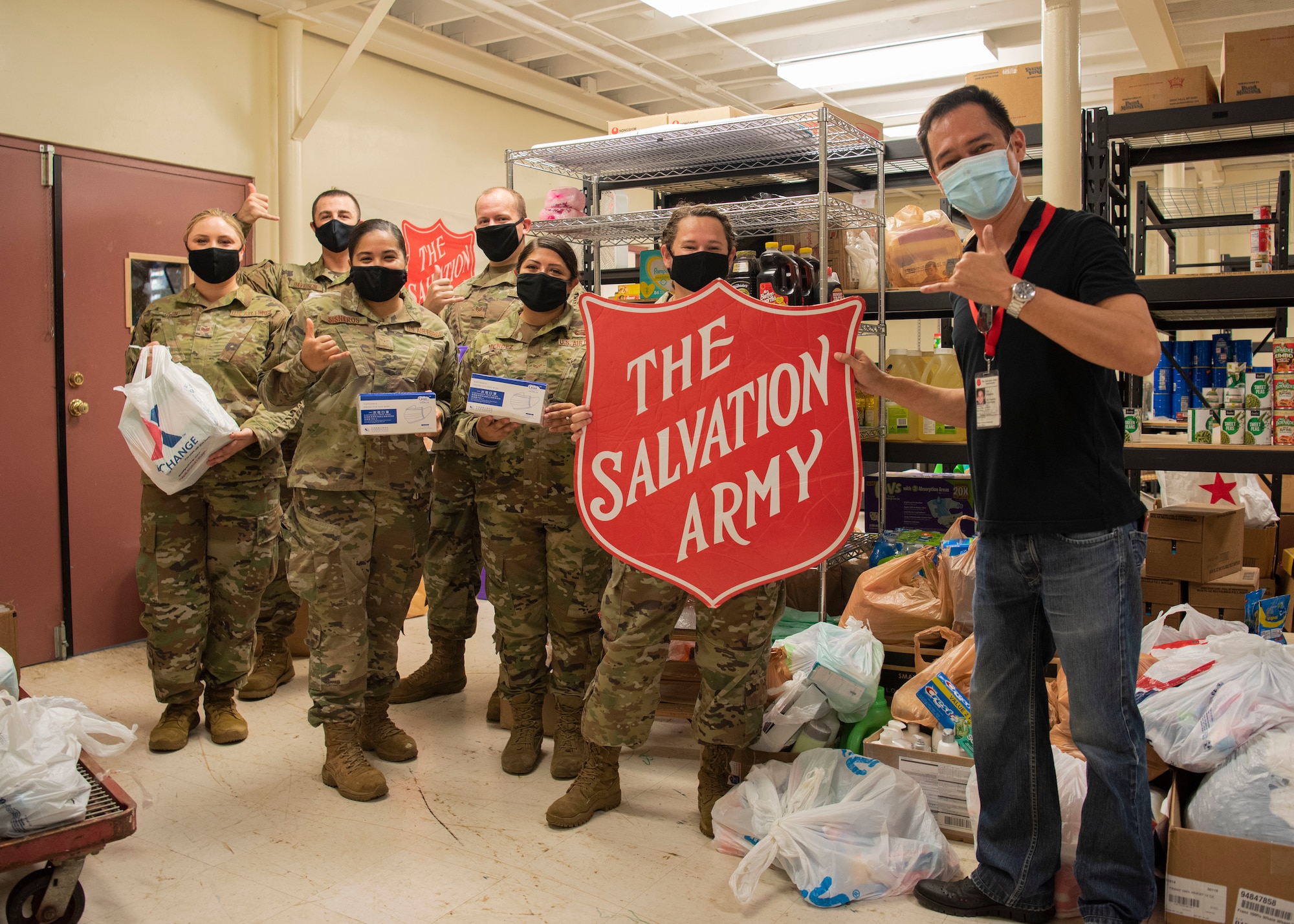 Members of the Air Force Sergeants Association Chapter 1560 gather for a photo with C.J. Urquico, The Salvation Army Guam Corps public relations and developments coordinator, during a donation delivery at The Salvation Army Guam Corps headquarters in Barrigada, Guam, April 8, 2021. The AFSA members garnered more than 1,800 items through donation drives during the month of March, which totaled to $10,000 in assistance for The Salvation Army. (U.S. Air Force photo by Senior Airman Aubree Owens)