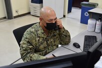 U.S. Navy Reservist take the Watch at Expeditionary Strike Group 7