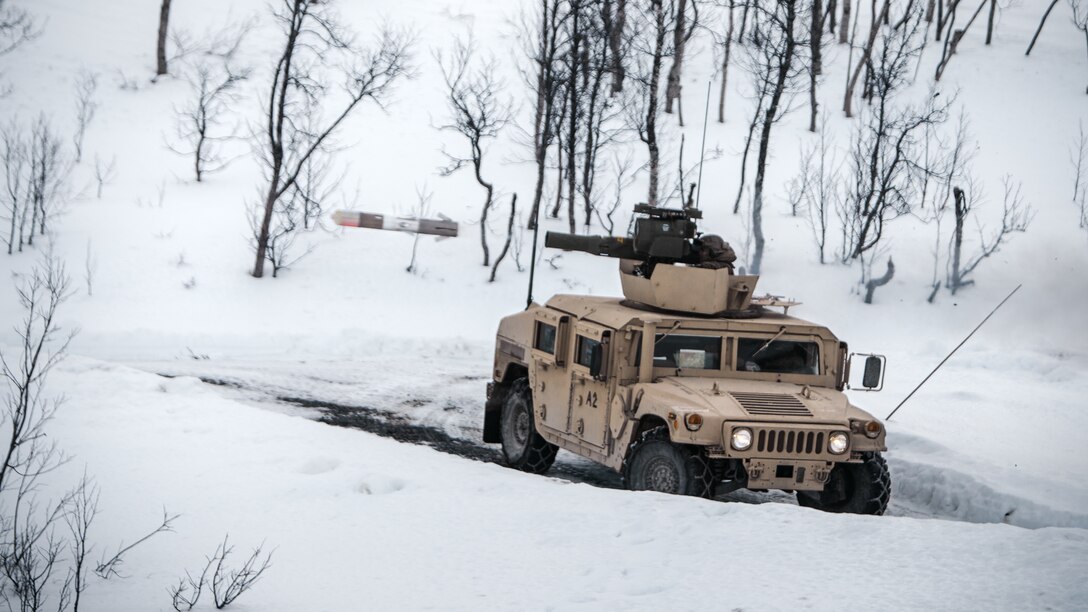 U.S. Marines with Marine Rotational Force Europe 21.1 (MRF-E), Marine Forces Europe and Africa, fire a TOW missile system during a company live-fire attack as part of Exercise Arctic Littoral Strike in Blåtind, Norway, March 29, 2021. Exercise Arctic Littoral Strike improved MRF-E’s ability to confront the challenges of anti-access, area denial capabilities posed by a notional peer adversary in a contested littoral environment. MRF-E demonstrated the ability to support joint fleet operations by providing over watch to a Norwegian submarine and destroying a notional adversary integrated air defense system. MRF-E focuses on regional engagements throughout Europe by conducting various exercises, arctic cold-weather and mountain warfare training, and military-to-military engagements, which enhance overall interoperability of the U.S. Marine Corps with allies and partners. (U.S. Marine Corps photo by Cpl. Patrick King)