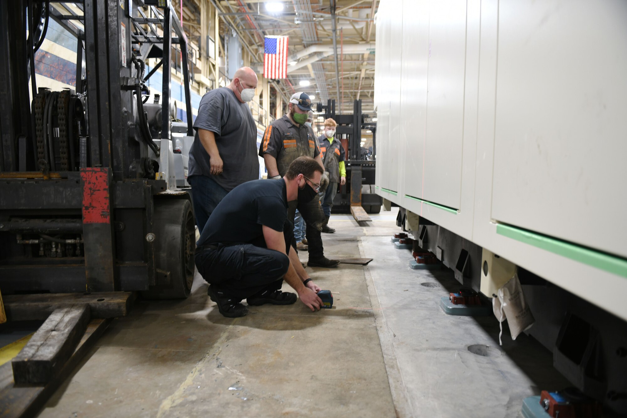 men working on a machine