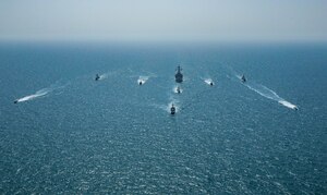 Royal Bahrain Naval Force fast attack craft RBNS Abdul Rahman Al-fadel (P 22), Bahrain Coast Guard response boats Hawar 5 and Hawar 4, U.S. Navy guided-missile destroyer USS Mahan (DDG 72), patrol coastal ships USS Squall (PC 7) and USS Hurricane (PC 3), U.S. Coast Guard patrol boat USCGC Adak (WBP 1333) and two Mark VI patrol boats operate in formation during exercise Neon Defender in the Arabian Gulf, April 7. Neon Defender 21 is a bilateral maritime exercise between the U.S. and Bahrain, designed to enhance interoperability and readiness, fortify military-to-military relationships and advance operational capabilities, allowing participating naval forces to effectively develop the necessary skills to address threats to regional security, freedom of navigation and the free flow of commerce. (Army Photo by Spc. Evens Milcette Jr.)