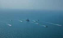 Royal Bahrain Naval Force fast attack craft RBNS Abdul Rahman Al-fadel (P 22), Bahrain Coast Guard response boats Hawar 5 and Hawar 4, U.S. Navy guided-missile destroyer USS Mahan (DDG 72), patrol coastal ships USS Squall (PC 7) and USS Hurricane (PC 3), U.S. Coast Guard patrol boat USCGC Adak (WBP 1333) and two Mark VI patrol boats operate in formation during exercise Neon Defender in the Arabian Gulf, April 7. Neon Defender 21 is a bilateral maritime exercise between the U.S. and Bahrain, designed to enhance interoperability and readiness, fortify military-to-military relationships and advance operational capabilities, allowing participating naval forces to effectively develop the necessary skills to address threats to regional security, freedom of navigation and the free flow of commerce. (Army Photo by Spc. Evens Milcette Jr.)