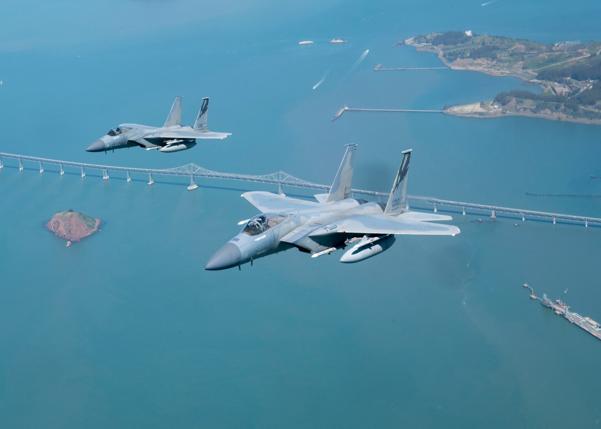NORAD F-15 jet fighters flew simultaneously off both U.S coasts for Exercise Noble Defender April 6. Noble Defender simulated air defense of ports in the southeast and southwest.