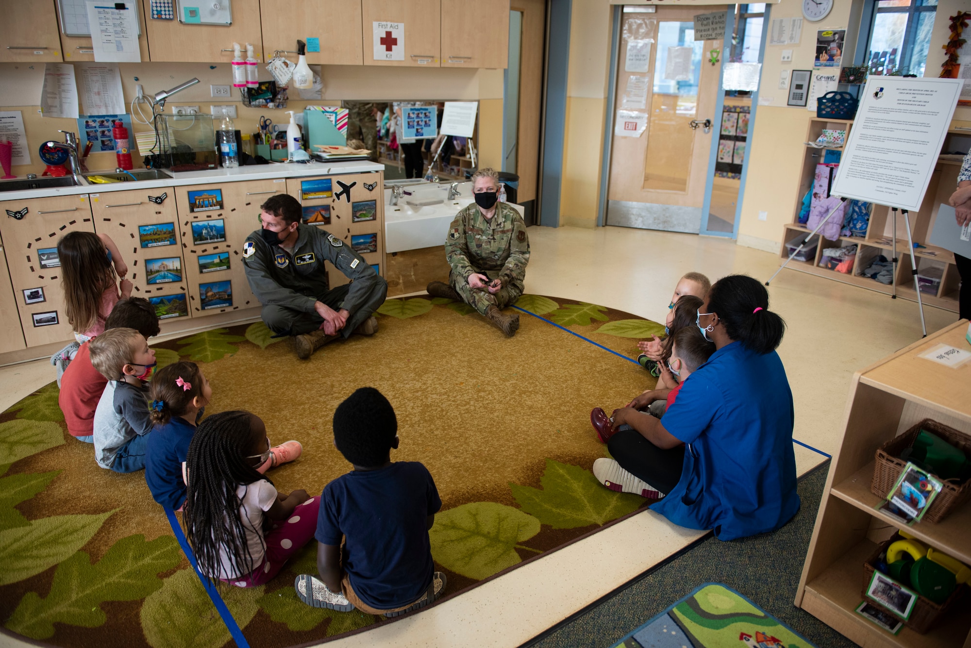 52nd Fighter Wing leadership sits down with children at the Child Development Center on Spangdahlem Air Base, Germany, April 1, 2021. April is the beginning of Child Abuse Prevention Month, which recognizes the hundreds of thousands of children who fall victim to child abuse and neglect each year. (U.S. Air Force photo by Senior Airman Melody W. Howley)