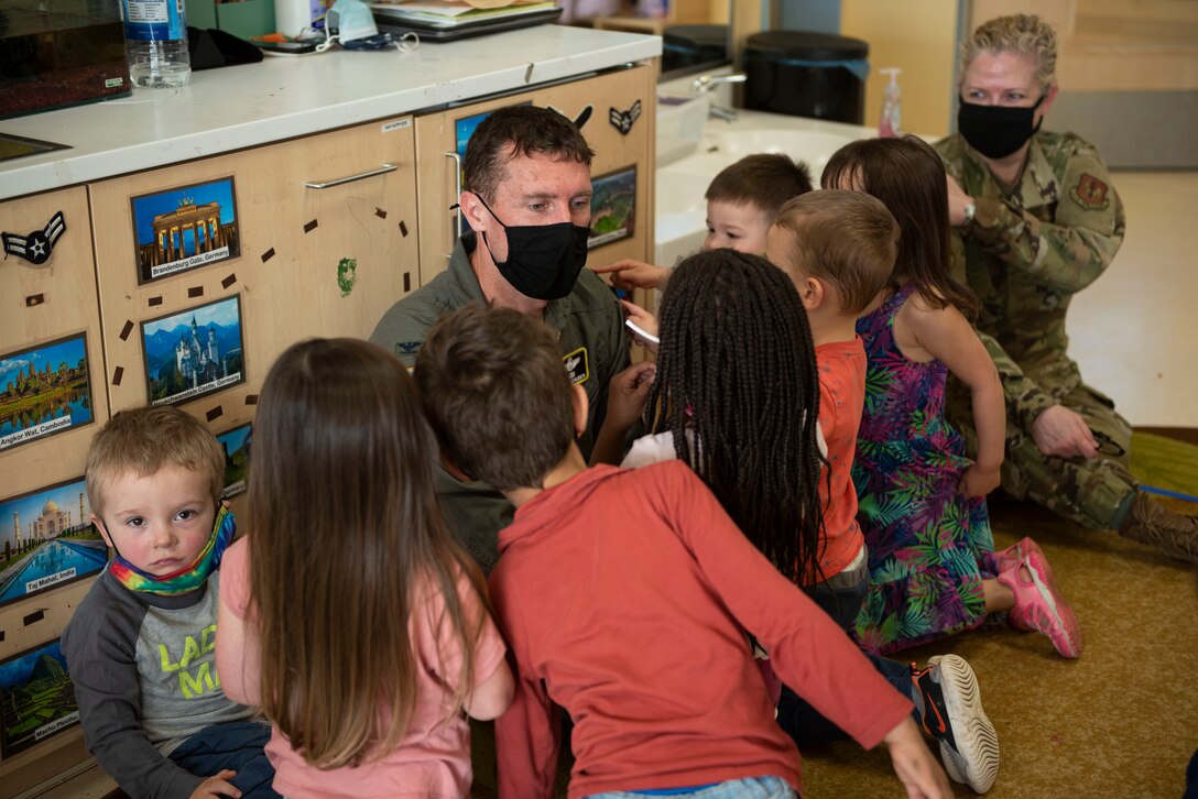 52nd Fighter Wing leadership sits down with children at the Child Development Center on Spangdahlem Air Base, Germany, April 1, 2021. Wing leadership talked to children at the CDC about what Child Abuse Prevention month means to them and how they can prevent it from happening. (U.S. Air Force photo by Senior Airman Melody W. Howley)