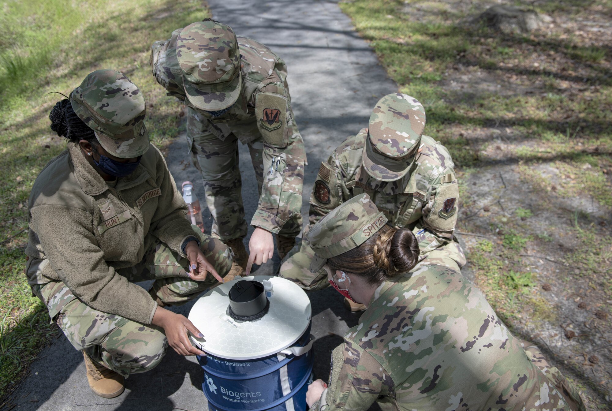 Airmen assemble mosquito trap.