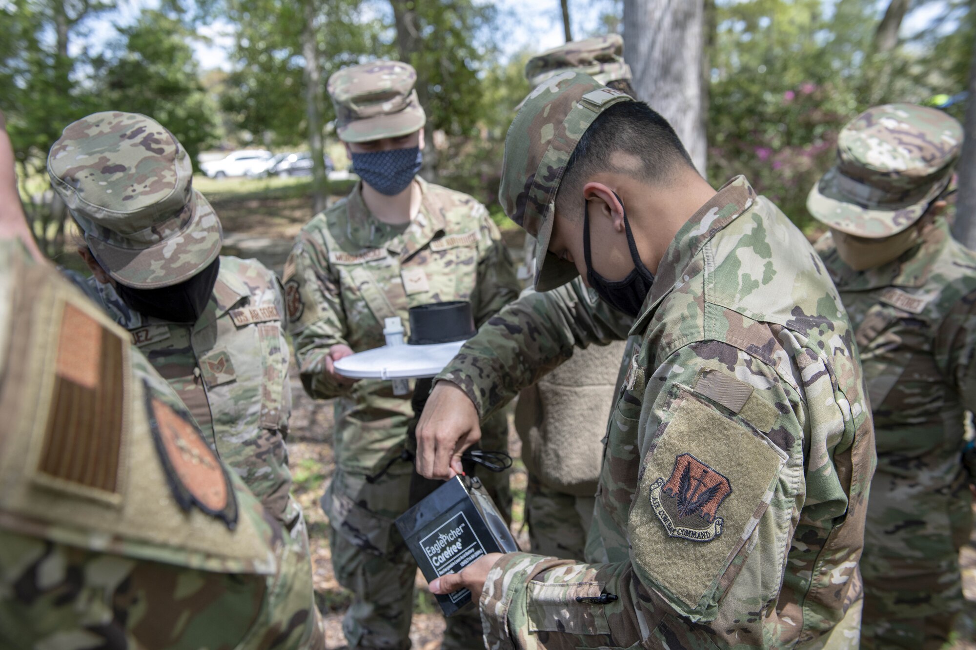 Airmen assemble mosquito trap.