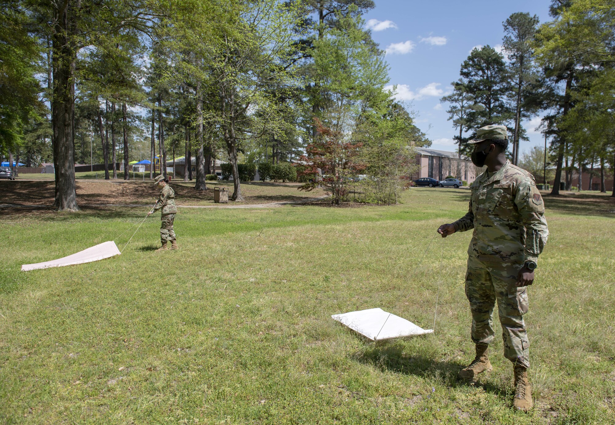 Photo of Airmen using drag mats.