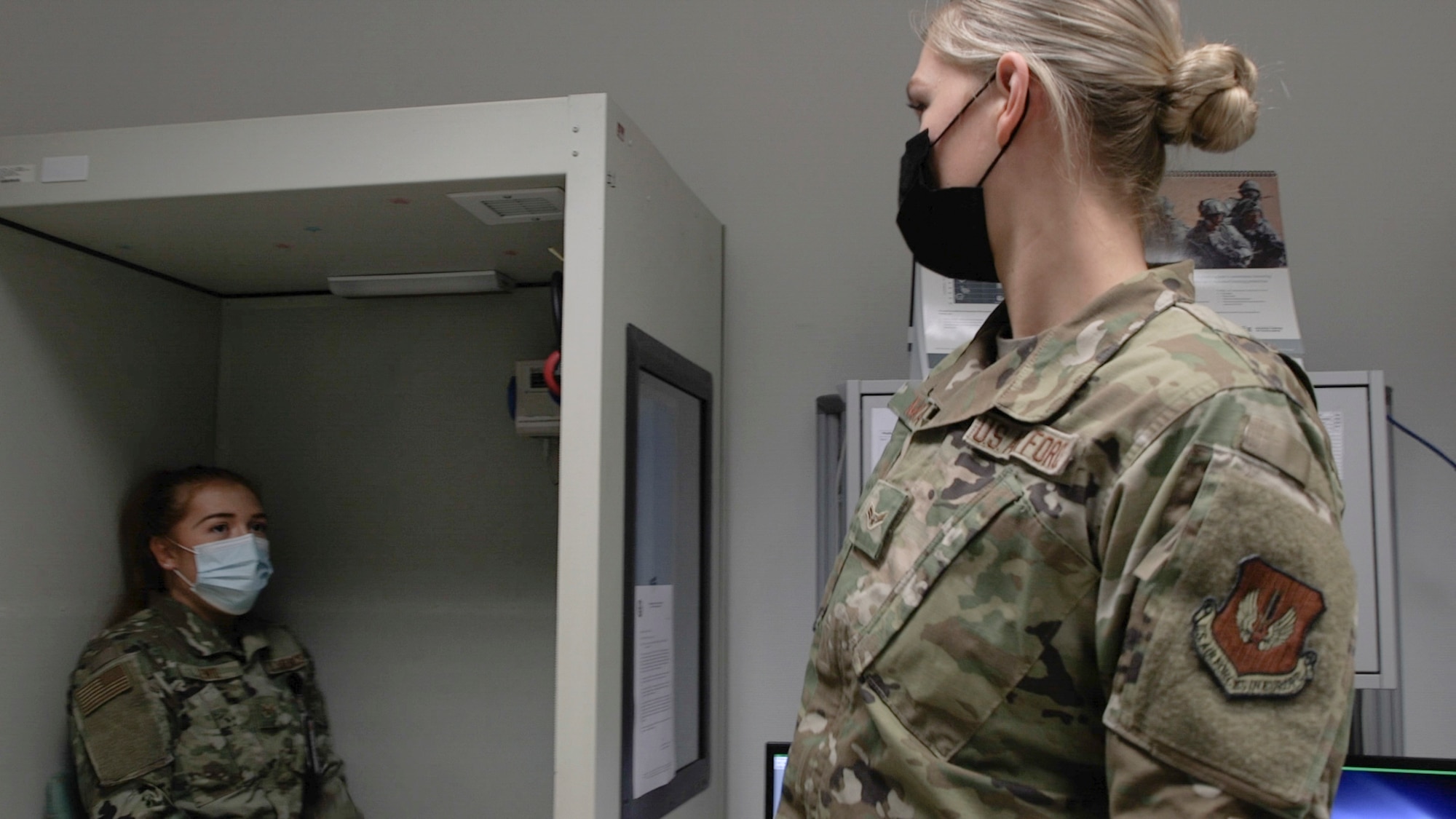U.S. Air Force Airman 1st Class Bo Murray, 52nd Medical Group Public Health technician (right), prepares to give an audiogram test to  U.S. Air Force Senior Airman Alison Lewis, 52nd Medical Group Public Health technician, at Spangdahlem Air Base, Germany, March 29, 2021. As part of the Force Health Management section, the technicians are responsible for programs that deal with deployments, TDYs, occupational environmental health, as well as travel medicine. (U.S. Air Force photo by Tech. Sgt. Warren D. Spearman Jr.)