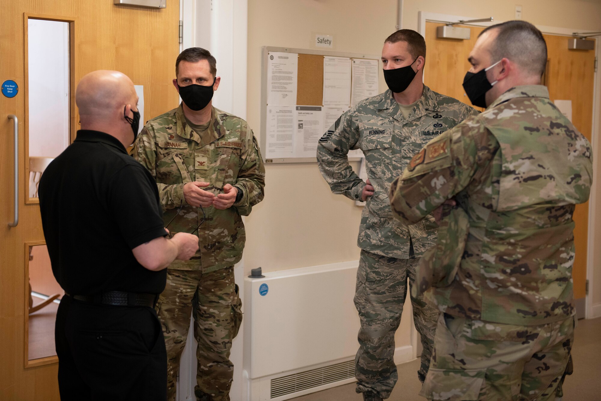 Keith Jimmo, left, 422nd Civil Engineer Squadron fire chief, discusses working with the counties’ ambulance services with U.S. Air Force Col. Jon Hannah, second left, 422nd Air Base Group commander, during an EMT practical application exam at Royal Air Force Croughton, England, March 31, 2021. U.K. firefighters across the 501st Combat Support Wing were tested in a practical application of their knowledge and skills, after attending over 280 hours of the U.S. National Registry of Emergency Medical Technicians course. The primary mission of the course was to prepare the fire department to respond to medical emergencies, as EMTs assume the responsibility of operating the ambulances and transporting patients to medical facilities. (U.S. Air Force photo by Senior Airman Jennifer Zima)