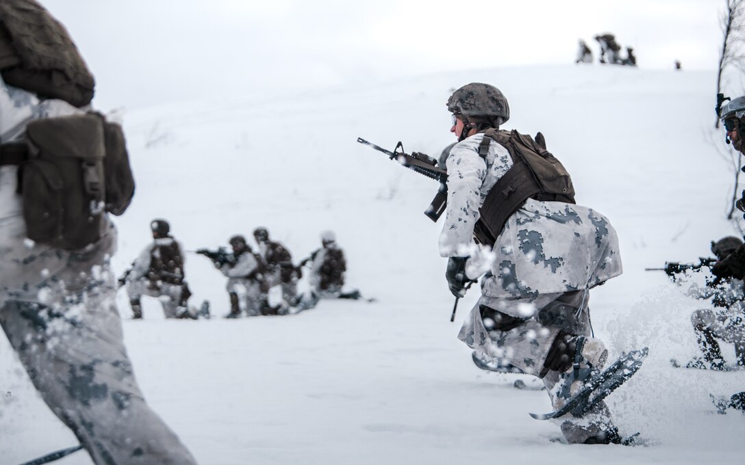 U.S. Marines with Marine Rotational Force Europe 21.1, Marine Forces Europe and Africa, buddy rush down range during a company live-fire attack as part of Exercise Arctic Littoral Strike in Blåtind, Norway, March 28, 2021. Exercise Arctic Littoral Strike improved MRF-E’s ability to confront the challenges of anti-access, area denial capabilities posed by a notional peer adversary in a contested littoral environment. MRF-E demonstrated the ability to support joint fleet operations by providing over watch to a Norwegian submarine and destroying a notional adversary integrated air defense system. MRF-E focuses on regional engagements throughout Europe by conducting various exercises, arctic cold-weather and mountain warfare training, and military-to-military engagements, which enhance overall interoperability of the U.S. Marine Corps with allies and partners.