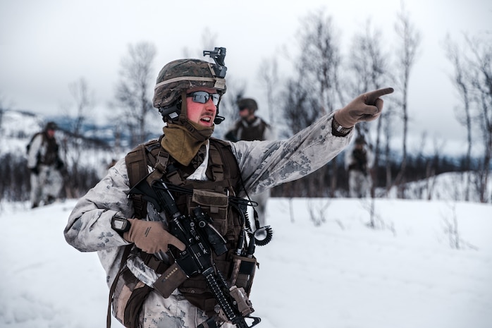 A U.S. Marine with Marine Rotational Force Europe 21.1, Marine Forces Europe and Africa, communicates with Marines down range during a company live-fire attack as part of Exercise Arctic Littoral Strike in Blåtind, Norway, March 30, 2021. Exercise Arctic Littoral Strike improved MRF-E’s ability to confront the challenges of anti-access, area denial capabilities posed by a notional peer adversary in a contested littoral environment. MRF-E demonstrated the ability to support joint fleet operations by providing over watch to a Norwegian submarine and destroying a notional adversary integrated air defense system. MRF-E focuses on regional engagements throughout Europe by conducting various exercises, arctic cold-weather and mountain warfare training, and military-to-military engagements, which enhance overall interoperability of the U.S. Marine Corps with allies and partners.